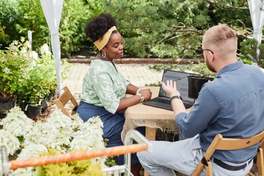 Professional landscape design consultation being held outdoors