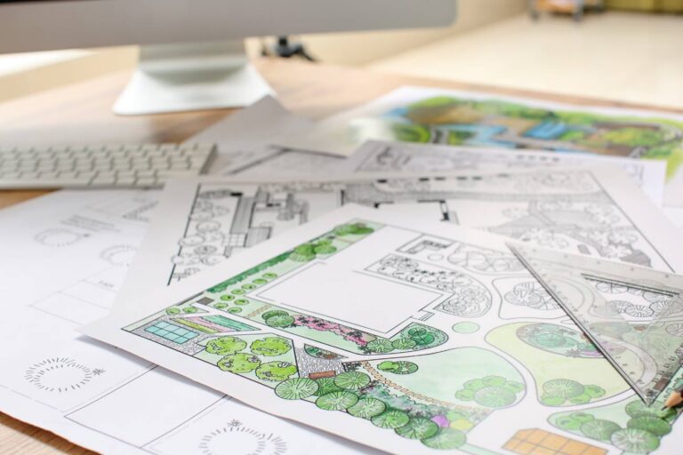 A stack of papers featuring landscape designs.